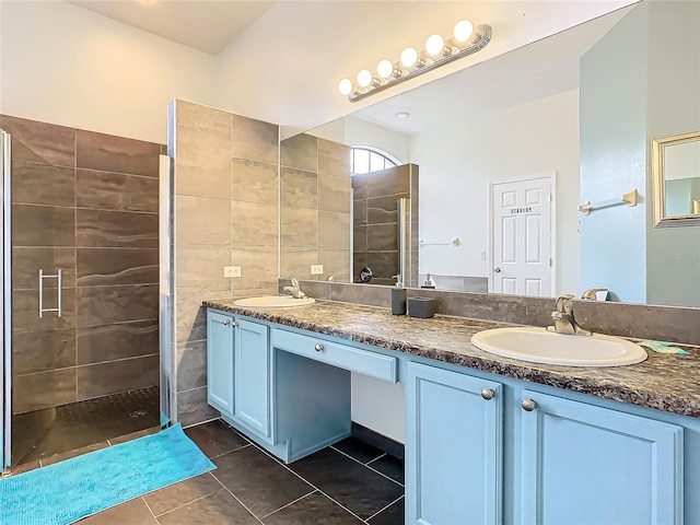 bathroom featuring vanity, an enclosed shower, tile walls, and tile patterned flooring