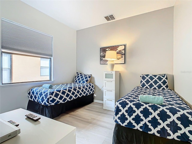 bedroom with wood-type flooring