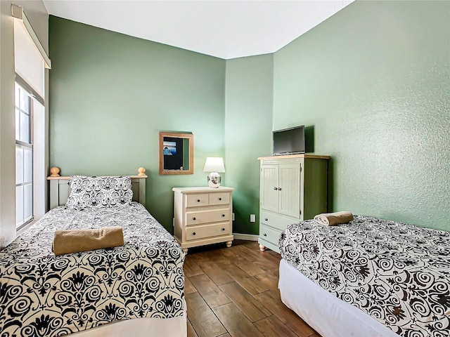 bedroom featuring dark wood-type flooring