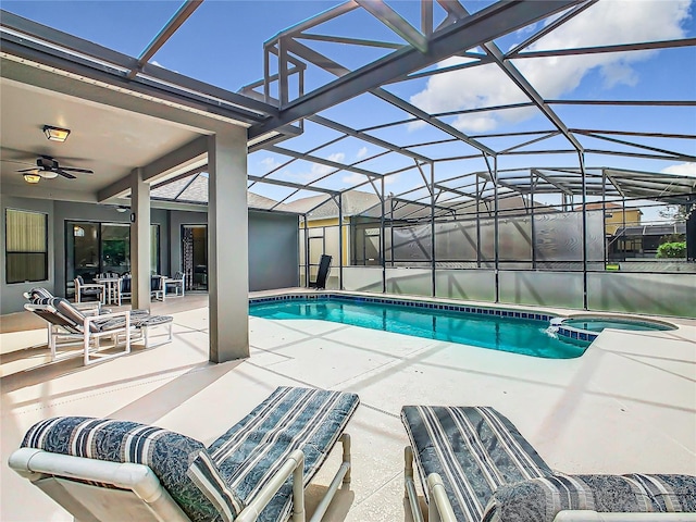 view of swimming pool with a patio, ceiling fan, and a lanai