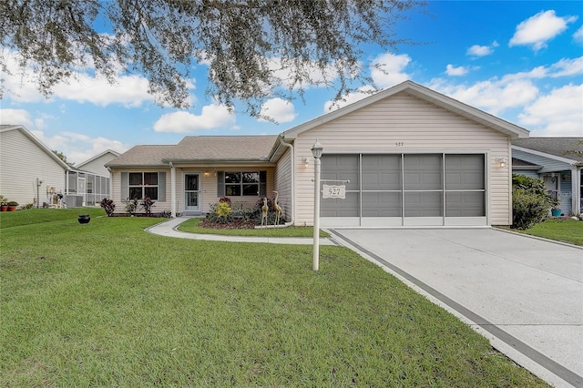 ranch-style home with a front lawn and a garage