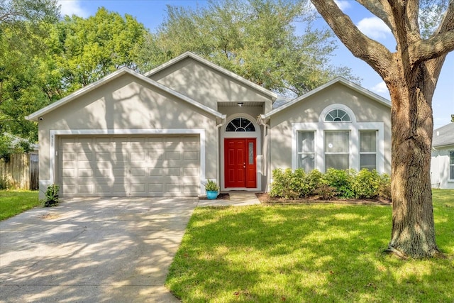 ranch-style house featuring a front lawn and a garage