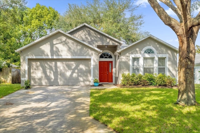 view of front of property featuring a garage and a front lawn