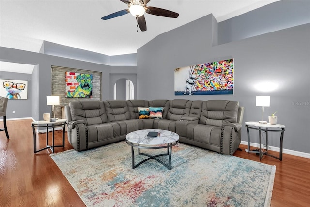 living room with lofted ceiling, wood-type flooring, and ceiling fan