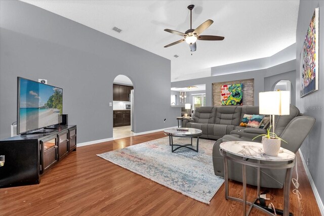 living room featuring hardwood / wood-style flooring and ceiling fan