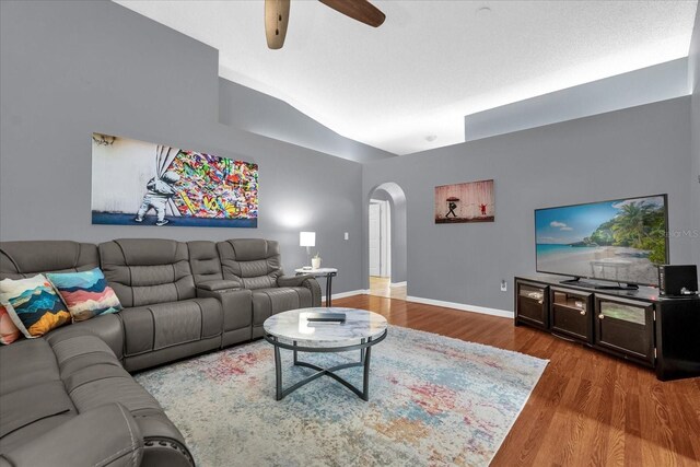 living room featuring hardwood / wood-style floors and ceiling fan