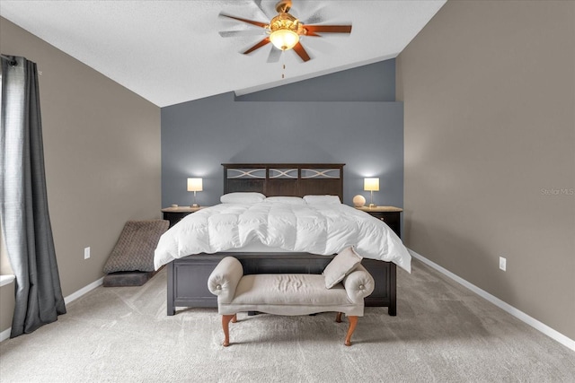 carpeted bedroom featuring vaulted ceiling and ceiling fan