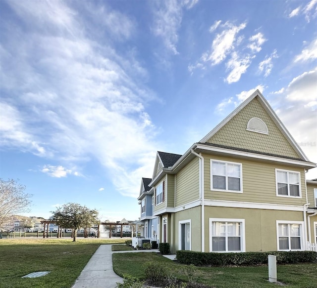 view of property exterior with a yard