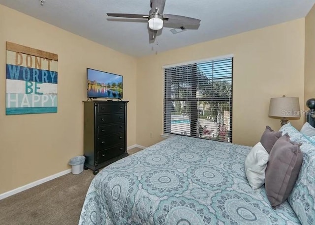 bedroom featuring carpet floors, a ceiling fan, baseboards, and visible vents