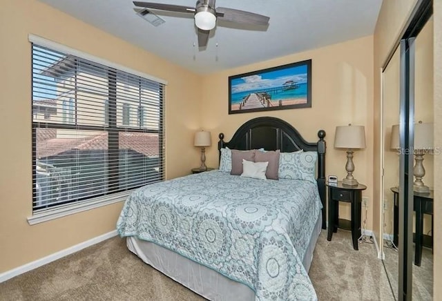 bedroom with ceiling fan, carpet, baseboards, visible vents, and a closet