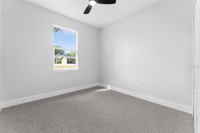 empty room featuring carpet and ceiling fan