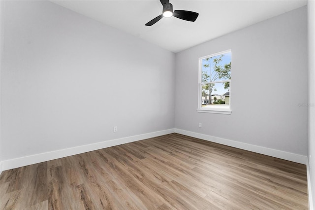 empty room with light hardwood / wood-style floors and ceiling fan