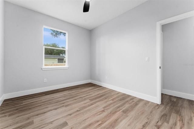 empty room with light hardwood / wood-style flooring and ceiling fan