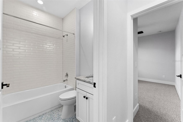 full bathroom with toilet, tiled shower / bath combo, and vanity