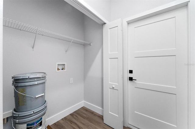 clothes washing area featuring hookup for a washing machine and hardwood / wood-style flooring