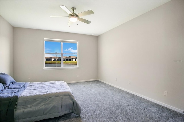 unfurnished bedroom with ceiling fan and carpet flooring