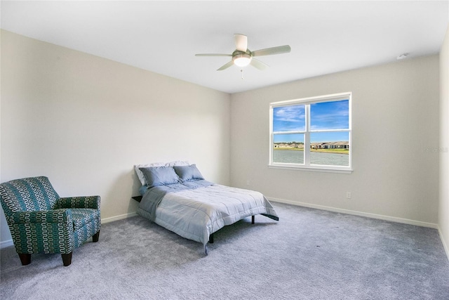 bedroom with ceiling fan and carpet floors