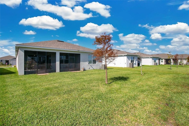 view of yard with a sunroom