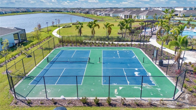 view of sport court with a water view