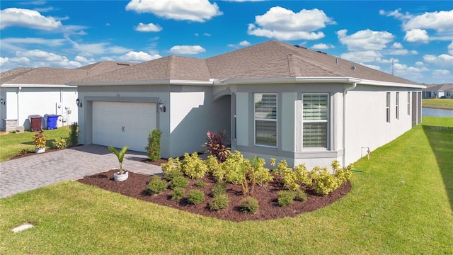 ranch-style house featuring a front yard and a garage