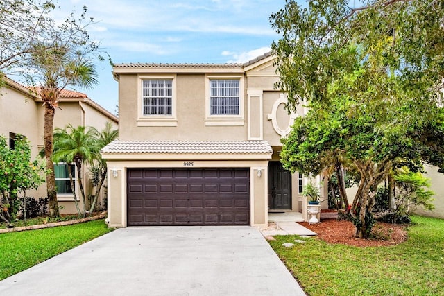 view of front of property featuring a front lawn and a garage