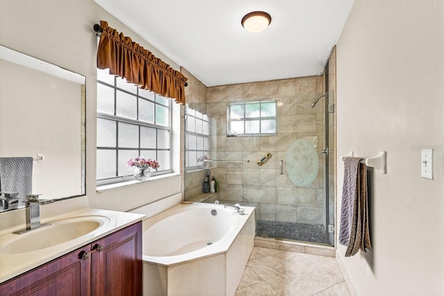 bathroom with vanity and independent shower and bath