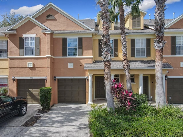 townhome / multi-family property featuring a garage