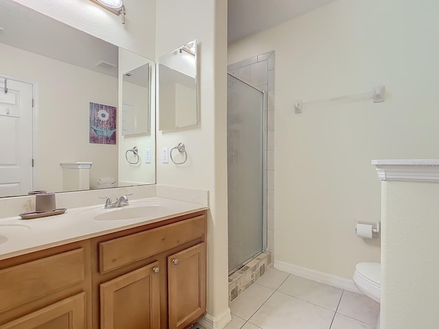 bathroom featuring vanity, tile patterned floors, toilet, and walk in shower