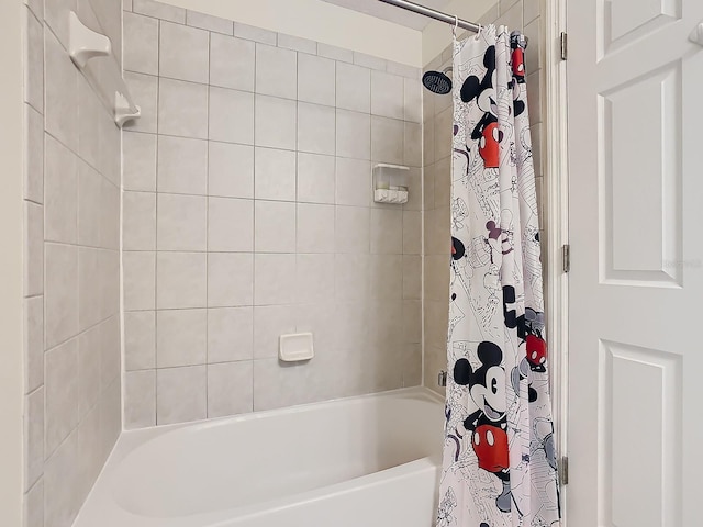 bathroom with shower / tub combo with curtain