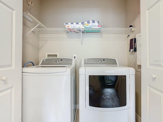 clothes washing area featuring washer and dryer