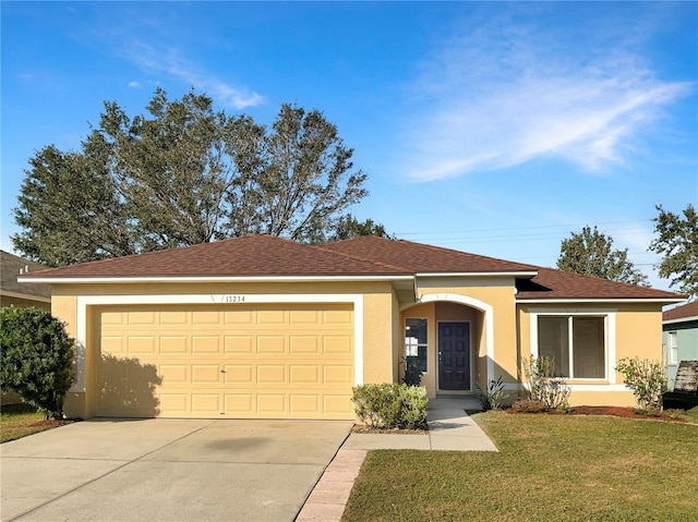 ranch-style home with a front yard and a garage