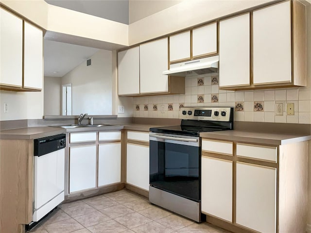 kitchen featuring dishwasher, sink, light tile patterned floors, white cabinets, and stainless steel electric range oven