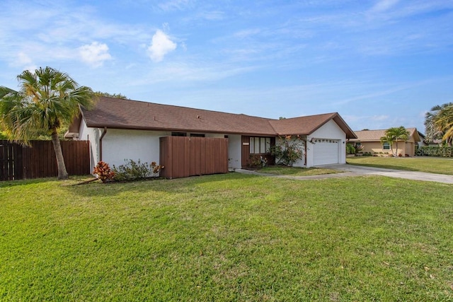 ranch-style home with a front yard and a garage