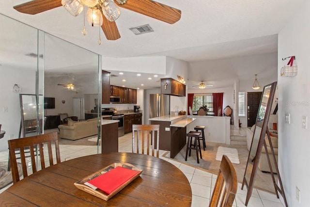 dining space with light tile patterned floors