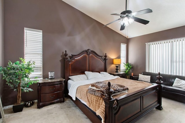 carpeted bedroom featuring high vaulted ceiling and ceiling fan