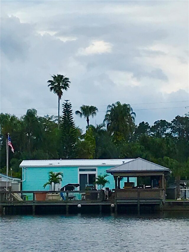 exterior space featuring a water view and a gazebo