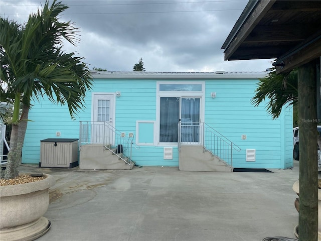 rear view of house featuring a patio area