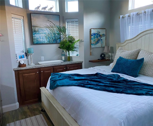 bedroom featuring dark hardwood / wood-style floors