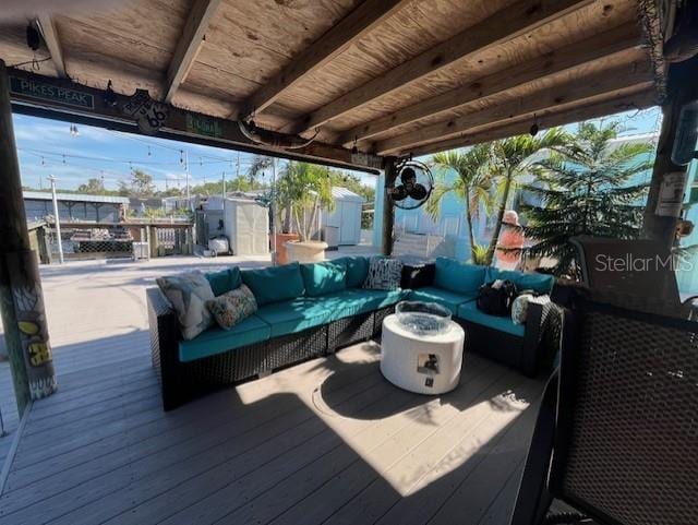 wooden terrace with outdoor lounge area