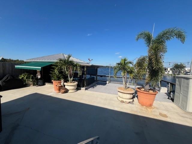 view of patio / terrace featuring a water view