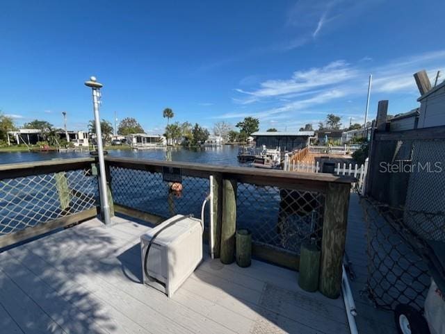 wooden deck with a water view