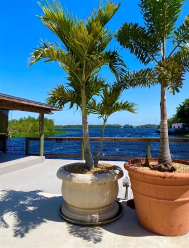 view of patio with a water view