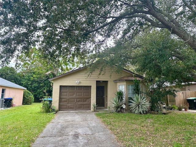 view of front facade with a front yard and a garage