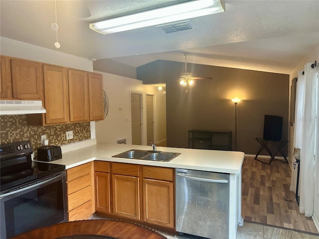 kitchen featuring kitchen peninsula, backsplash, black / electric stove, dishwasher, and sink