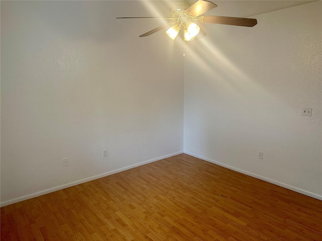 unfurnished room featuring hardwood / wood-style floors and ceiling fan