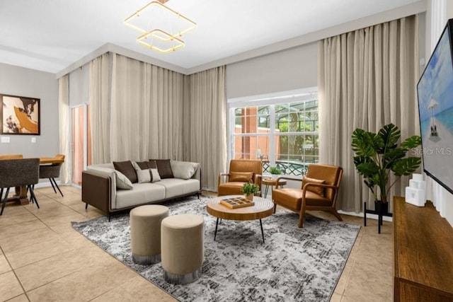 living room with a notable chandelier and light tile patterned floors