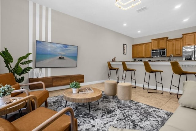 living room with light tile patterned flooring