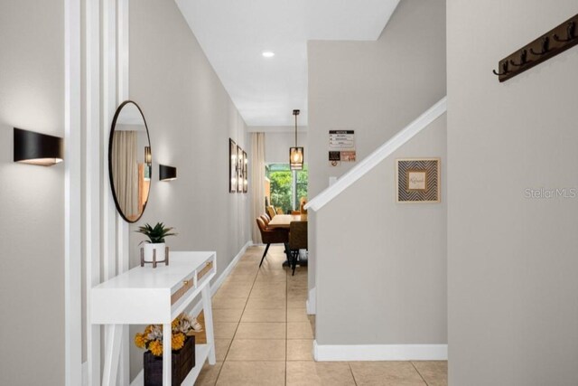 hallway featuring light tile patterned flooring