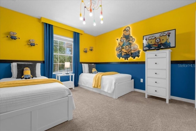 carpeted bedroom with a chandelier