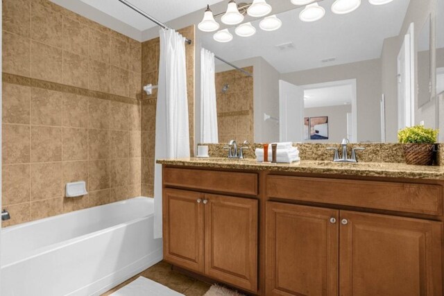 bathroom with vanity and shower / tub combo